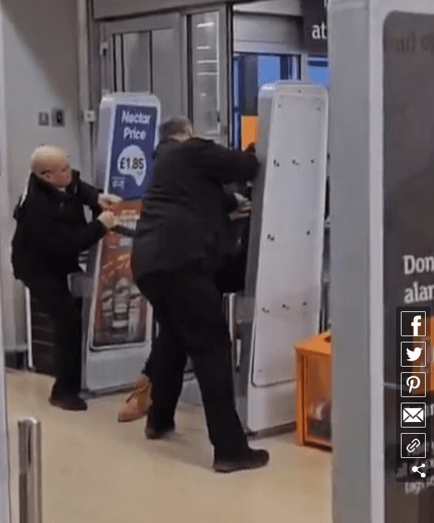 Dramatic footage shows the moment an alleged shoplifter wrestled with security guards at a Sainsbury's in Brighton, East Sussex, on Boxing Day 